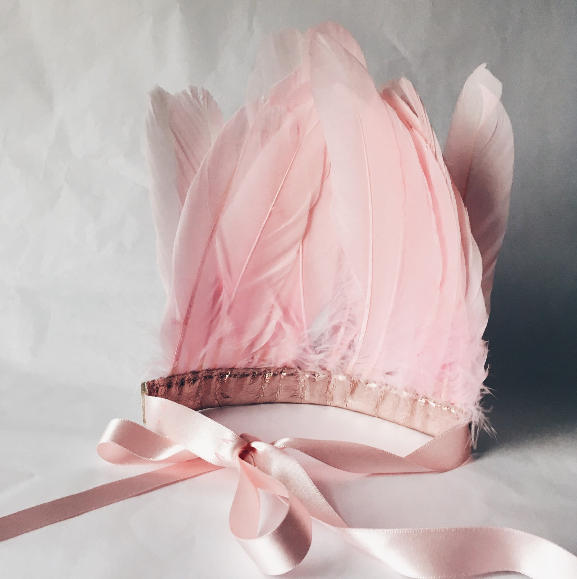 Back view of Pink feather and metallic leather headdress by For Just ONE Day