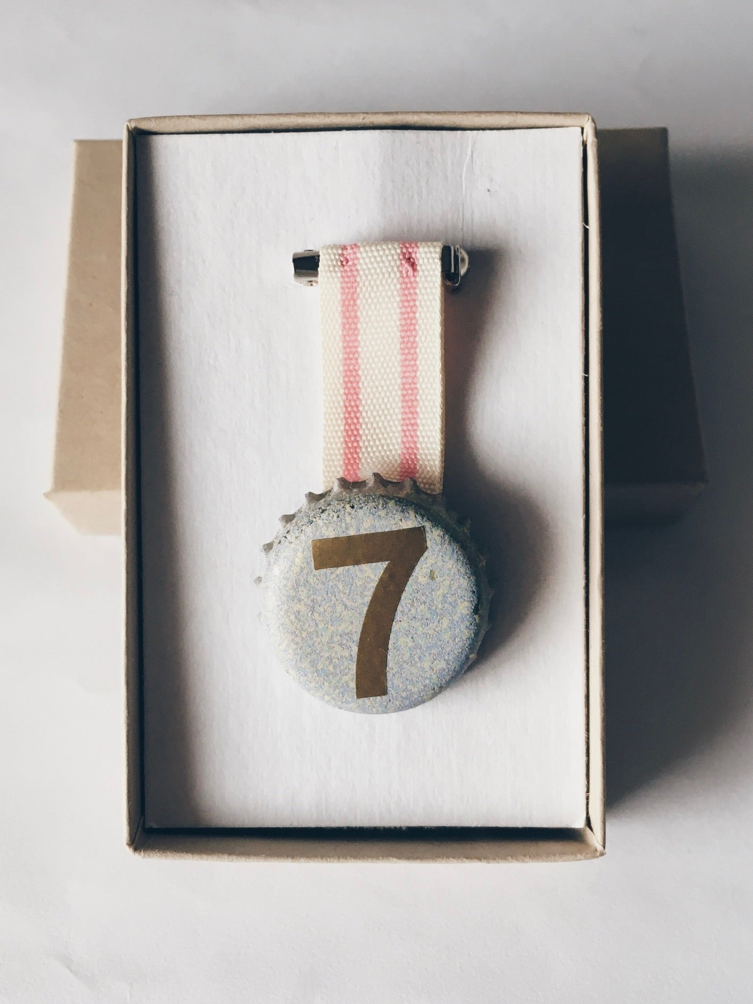 Number 7 Age medal birthday badge presented in a box 