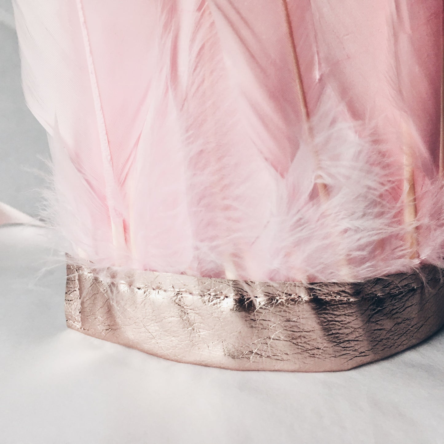 close up of Pink feather and metallic leather headdress by For Just ONE Day