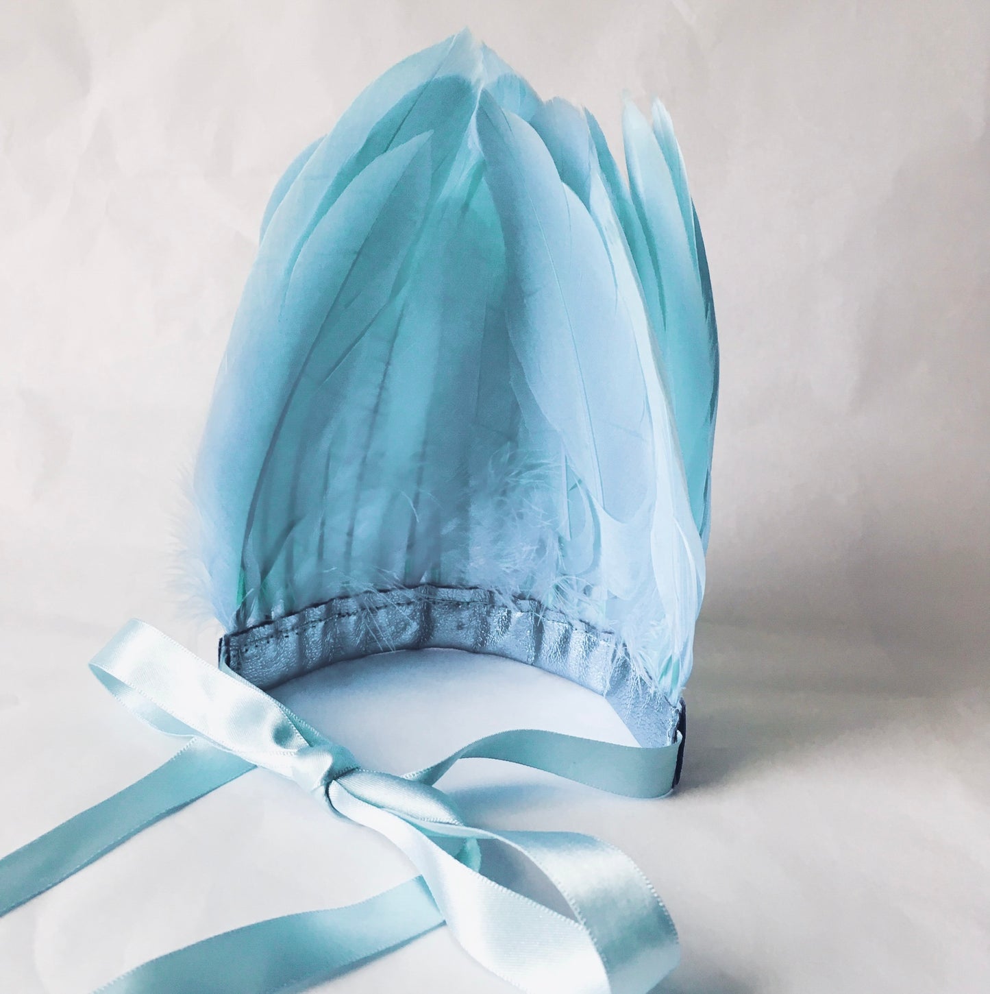 Back view of Pastel blue feather and leather headdress by For Just ONE Day