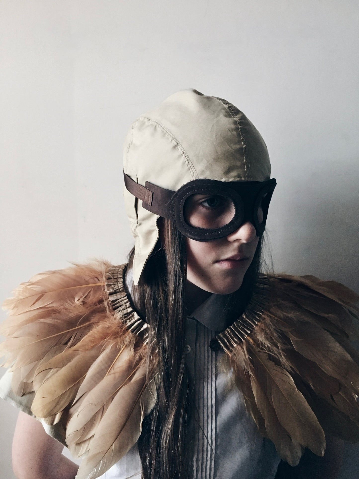 Child wearing a vintage inspired flying costume