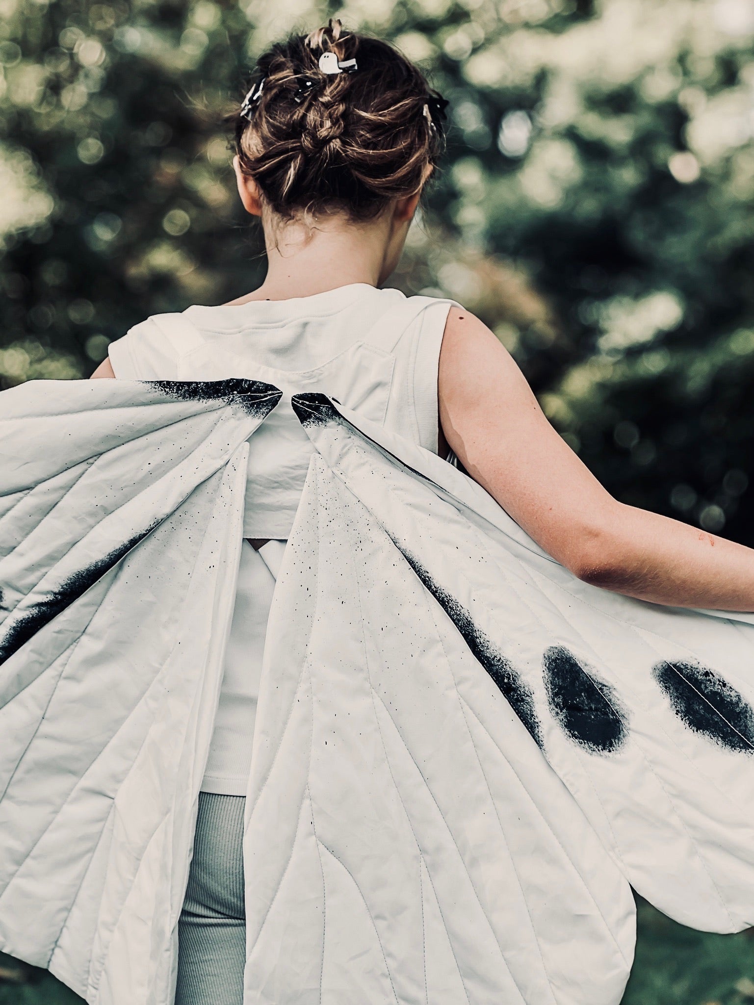 Back view of a girls wearing Butterfly wings