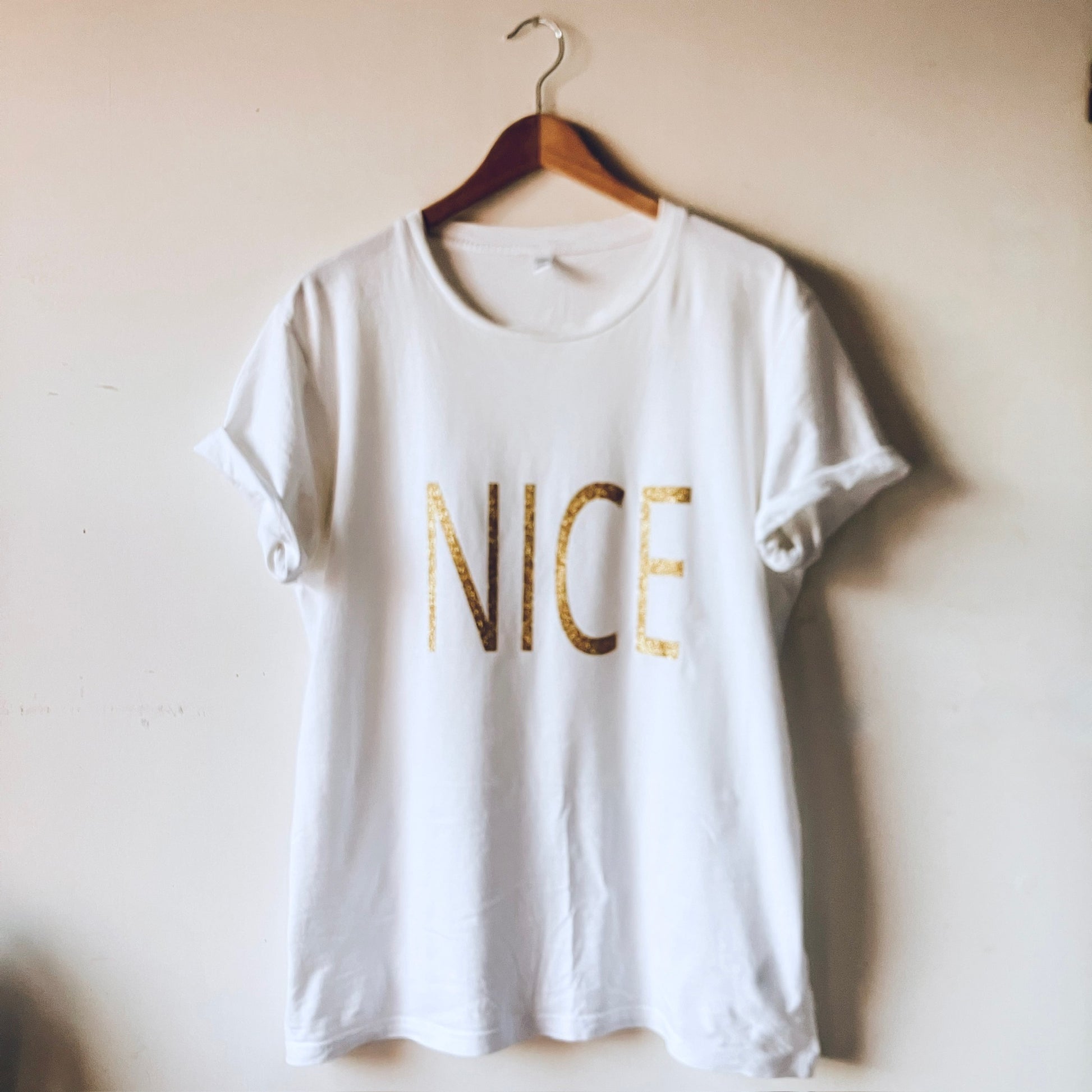 Nice list T-shirt white with gold glitter word 'NICE'