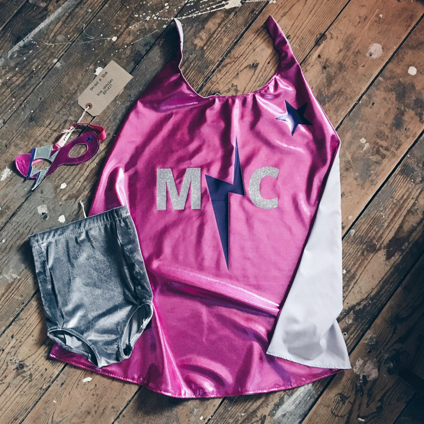 Flat lay of Magenta Pink superhero costume by For Just ONE Day