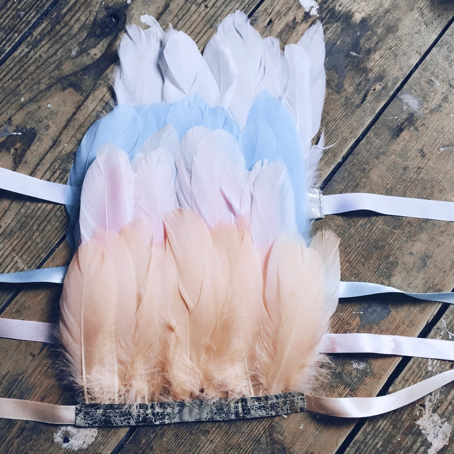 pastel coloured feather headdresses