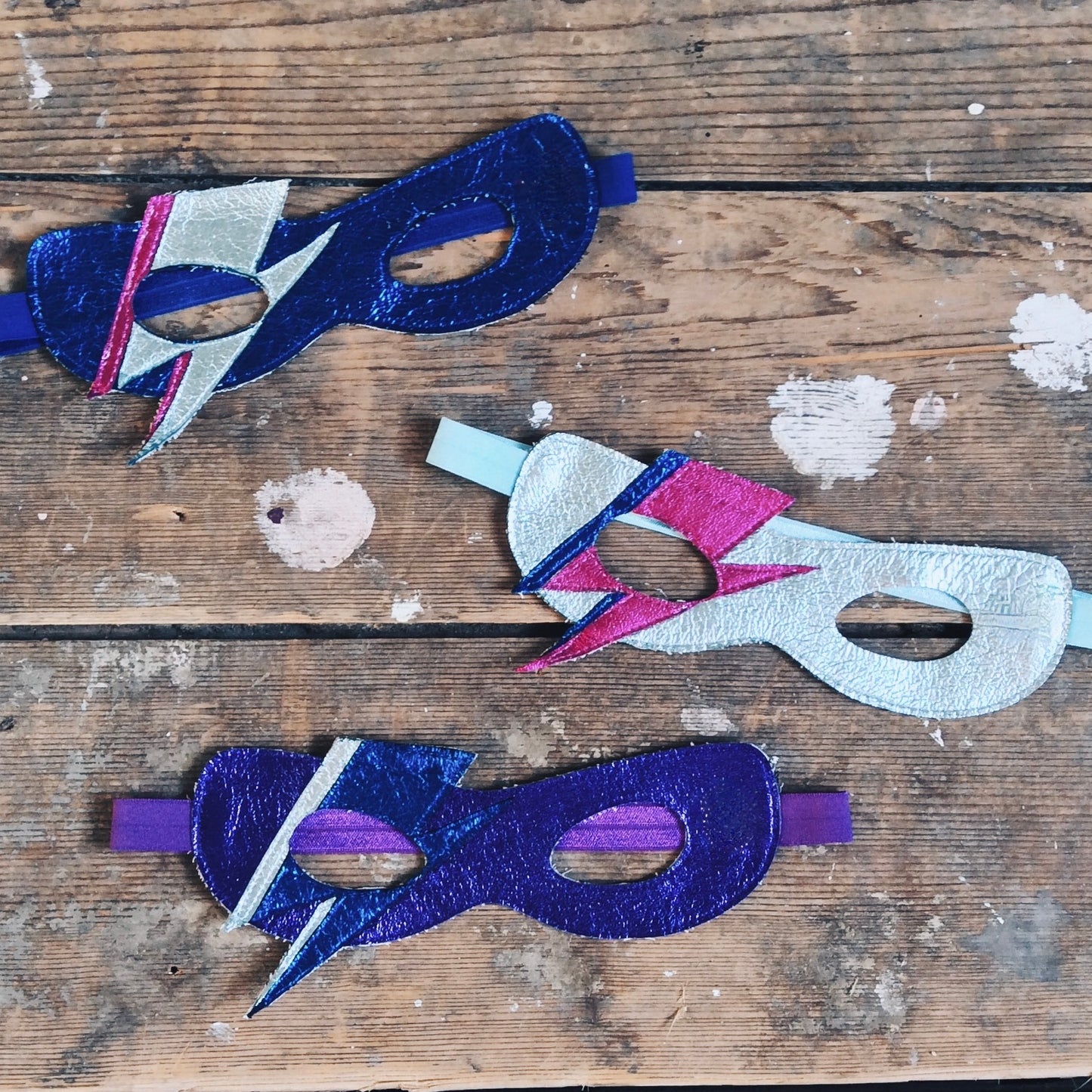 Colour variations of Metallic leather Bowie superhero mask by For Just ONE Day