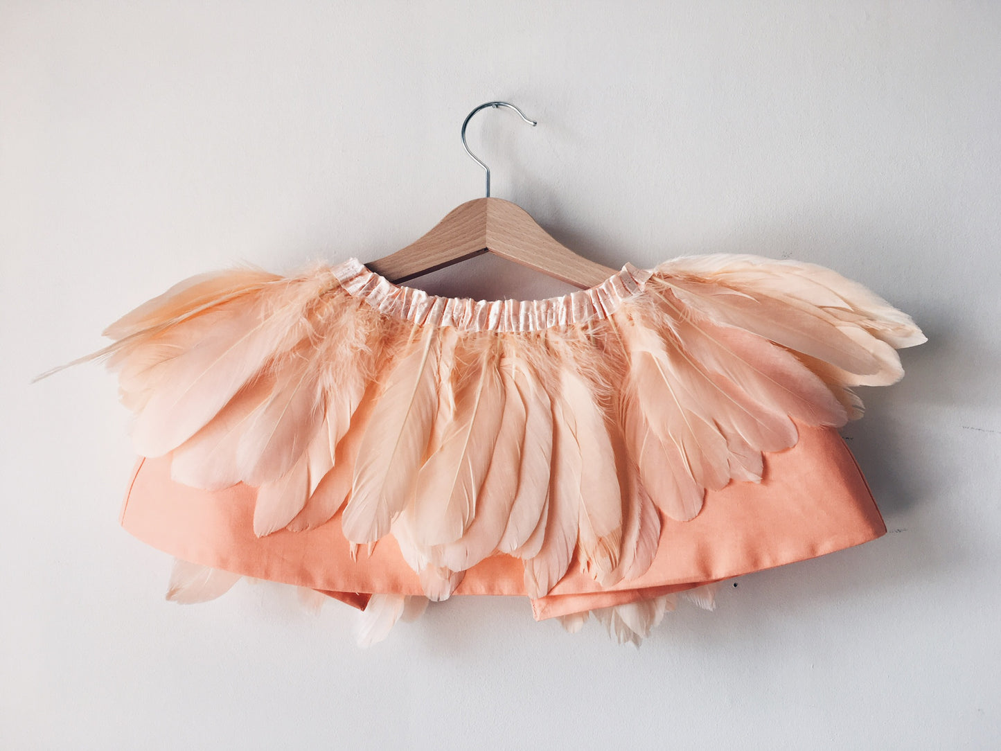 Back view of peach feather cape