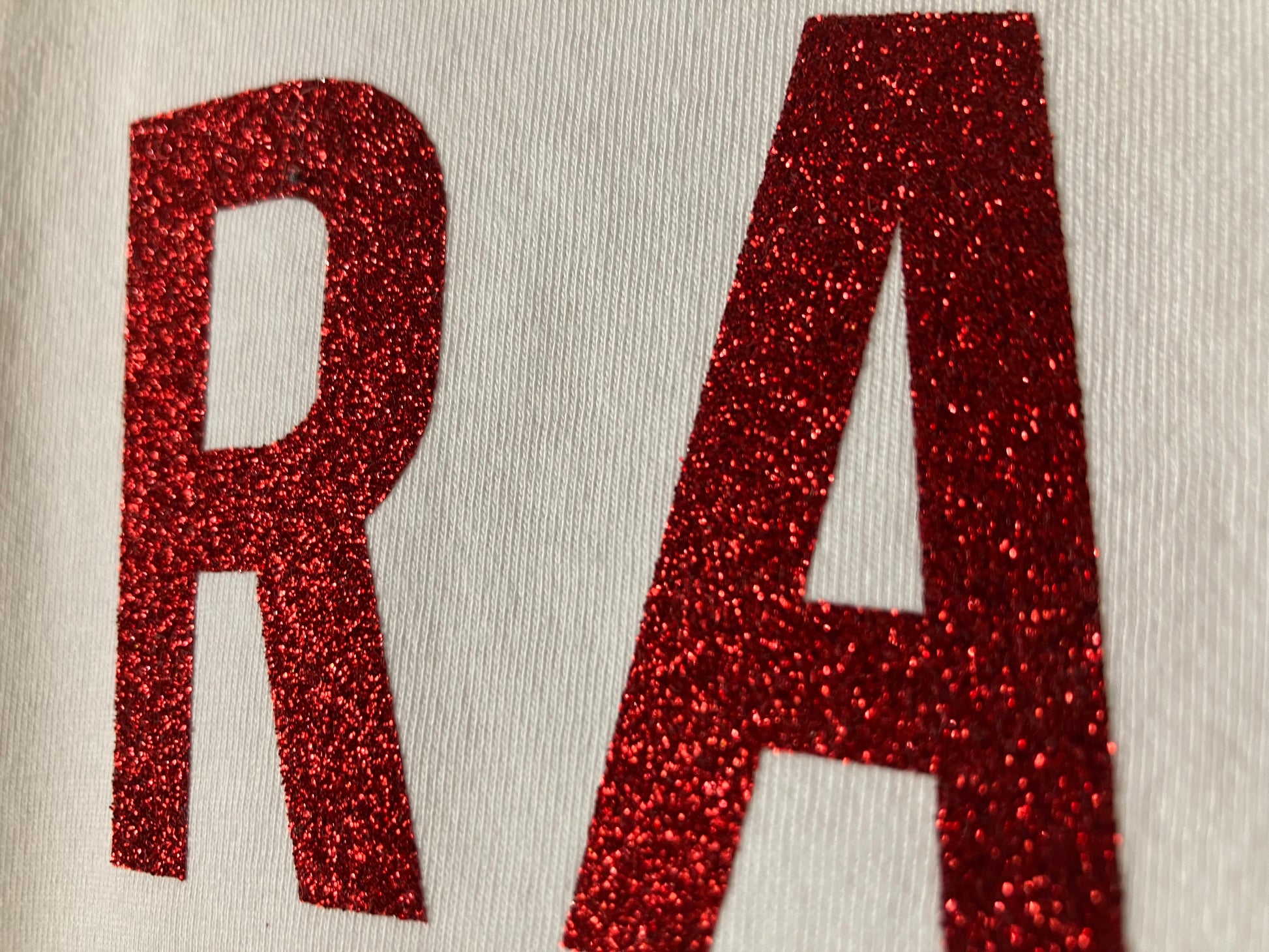 close up of red glitter print on white pirate t-shirt by For Just ONE Day